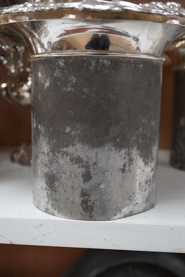 A pair of Old Sheffield plate two handled plated wine coolers, with later associated liners, 26cm high. Condition - fair